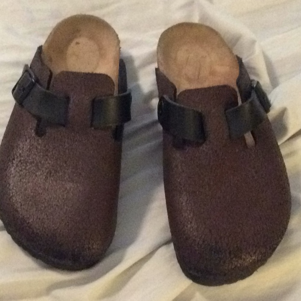 Brown and black trimmed Birkenstocks